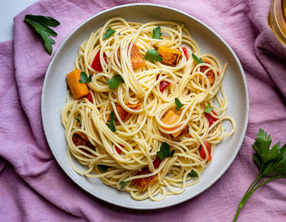 A light delicious pasta dish with some savory red peppers and sweet butternut squash