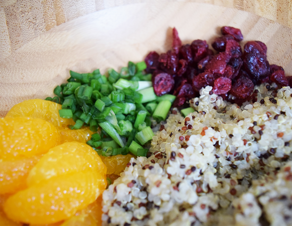 A bowl of orange quinoa salad